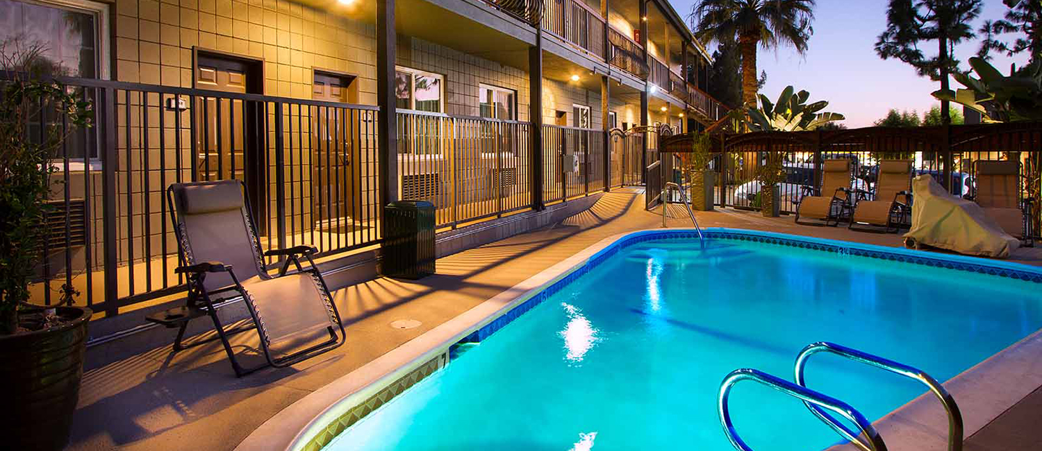 STAY AT THE TOP-RANKED HOTEL GRANADA INN AND ENJOY LUXURIOUS AMENITIES LIKE OUR POOL AND SUNBATHING PATIO